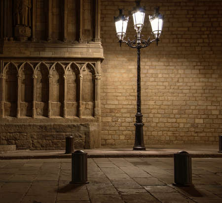 Beautiful streetlight in front of old building in Barcelonaの写真素材