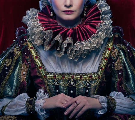 Queen in royal dress and luxuriant collar