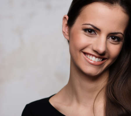 Young brunette woman with beautiful smileの写真素材