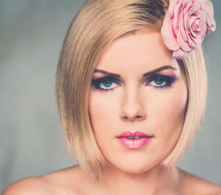 Beautiful woman with rosebud 