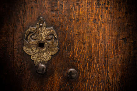 Keyhole on old wooden door
