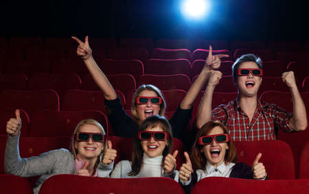Group of people in 3D glasses watching movie in cinemaの写真素材