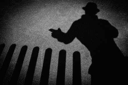 Strangers shadow on pavementの写真素材