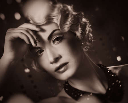 Toned portrait of elegant blond retro woman  with beautiful hairdo 