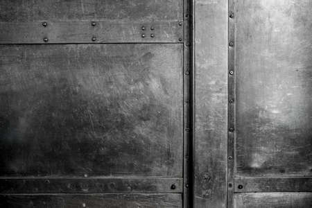 Scratched metallic background with rivetsの写真素材