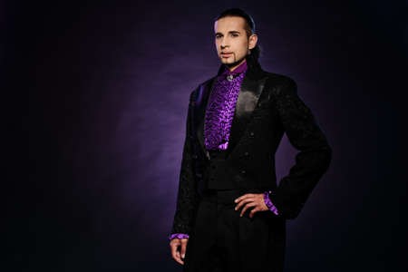 Young handsome brunette man in stage costumeの写真素材