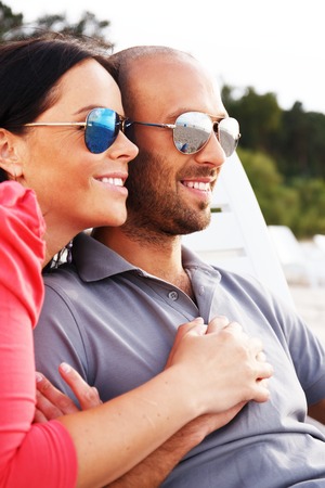 Happy smiling middle-aged couple on a beachの写真素材