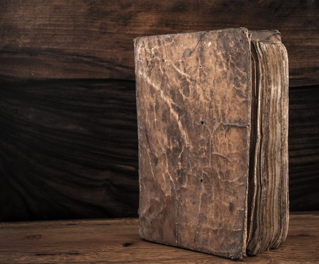Vintage book on a wooden background の写真素材