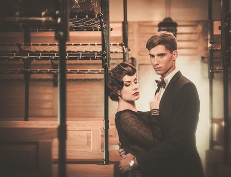 Beautiful vintage style couple inside retro train coach の写真素材