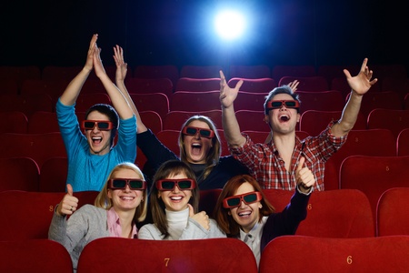 Group of people in 3D glasses watching movie in cinemaの写真素材