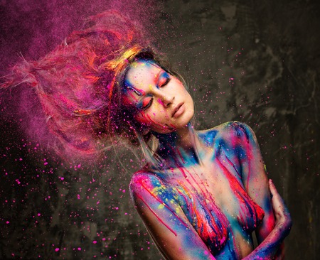 Young woman muse with creative body art and hairdo の写真素材