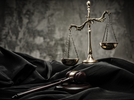 Scales and wooden hammer on judge's mantle 