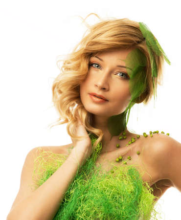 Beautiful young woman in conceptual spring costume の写真素材