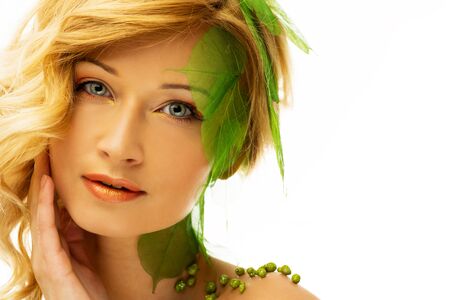 Beautiful young woman in conceptual spring costume の写真素材