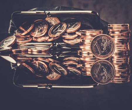 Purse with lot of euro coins の写真素材