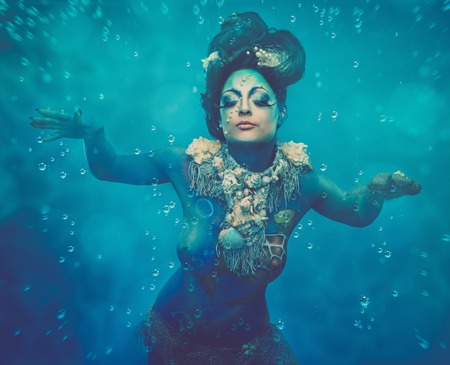 Fantasy underwater woman creature with body art の写真素材