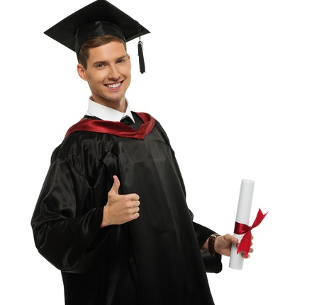 Cheerful young graduated student man isolated on white の写真素材