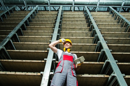 Happy worker in a storage room on a factory の写真素材