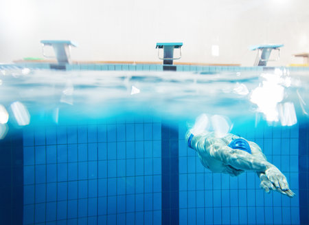 Swimmer under water in swimming poolの写真素材