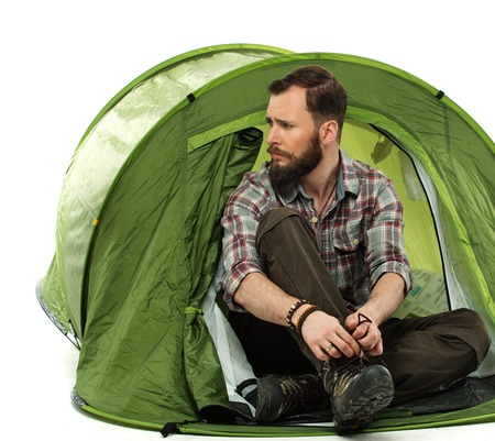 Handsome traveler in a tent の写真素材