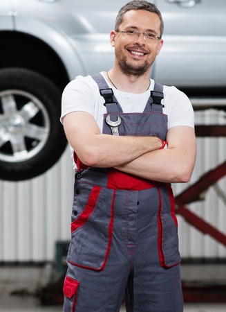 Serviceman in a car workshopの写真素材