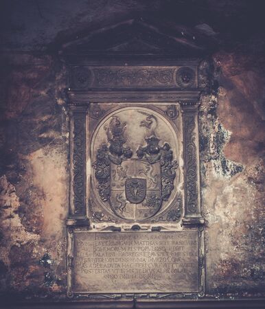 Coat of arms and old text on memorable wallの写真素材