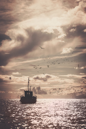 Fisherman's boat in a seaの写真素材