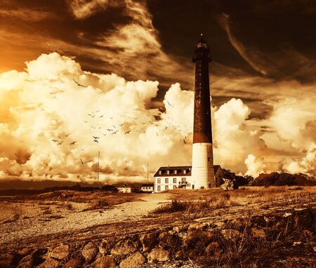 Lighthouse and keeper's house near beautiful bay の写真素材