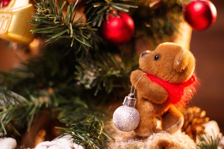 Christmas still life with teddy bear decorating tree の写真素材