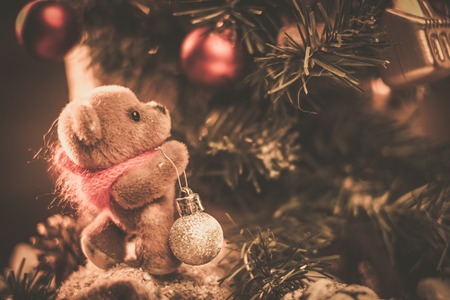 Christmas still life with teddy bear decorating tree の写真素材