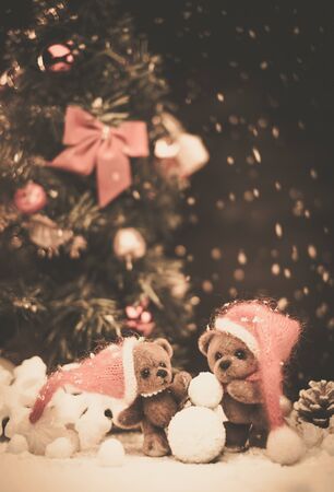 Small toy bears making snowman in christmas still life の写真素材
