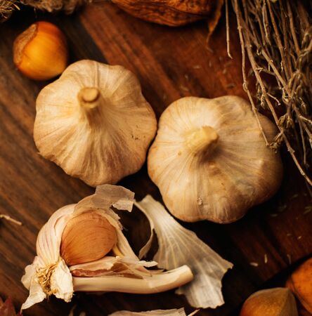Garlic on a wooden board background の写真素材
