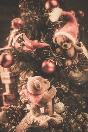 Christmas still life with teddy bears decorating tree の写真素材