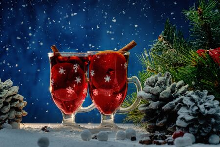 Cups with hot mulled wine in Christmas still life の写真素材