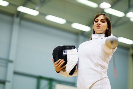 Young woman fencer with epeeの写真素材
