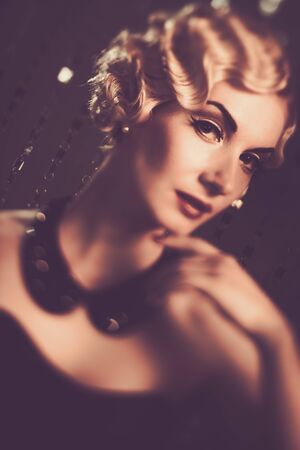 Elegant blond retro woman with beautiful hairdoの写真素材