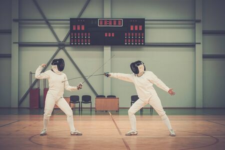 Two women fencers on a trainingの写真素材