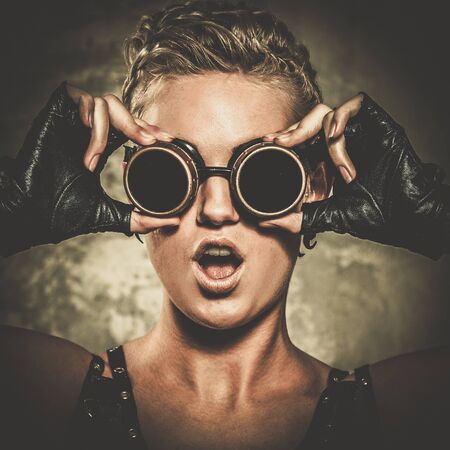 Attractive steampunk girl wearing googles