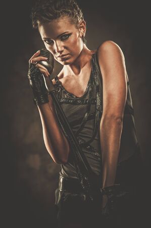 Attractive steampunk singer with microphone