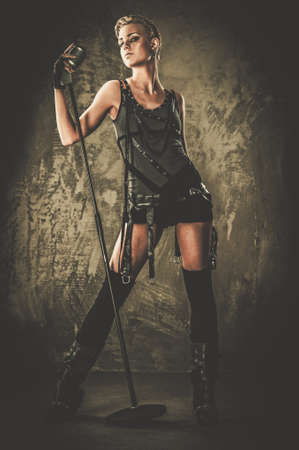 Attractive steampunk singer with microphone