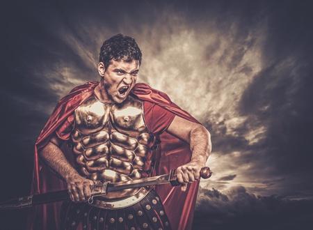 Legionary soldier against stormy skyの写真素材
