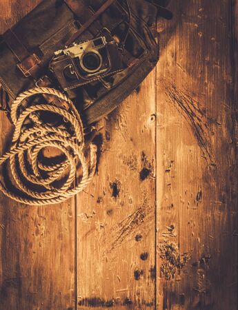 Vintage camera and handbag on wooden backgroundの写真素材