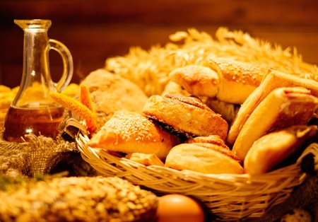 Basket with homemade baked goods on a tableの写真素材