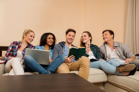 Group of students preparing for exams in apartment interior