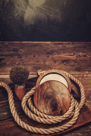 Shaving brush and soap on a luxury wooden backgroundの写真素材