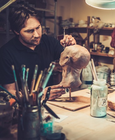 Man working in a prosthetic special fx workshop