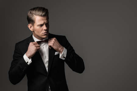 Sharp dressed man wearing jacket and bow tie