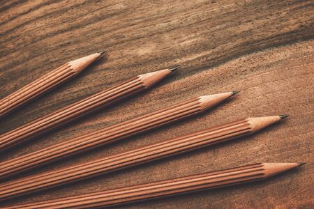 Luxurious charcoal drawing pencils on a wooden tableの写真素材