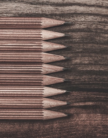 Luxurious charcoal drawing pencils on a wooden tableの写真素材