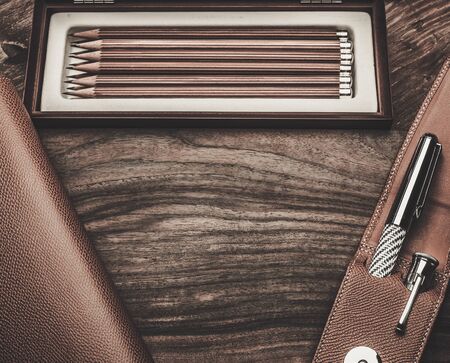 Luxurious writing tools on a wooden tableの写真素材